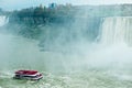 Canadian side of Niagara Falls in autumn. ship with tourists Royalty Free Stock Photo