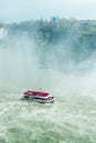 Canadian side of Niagara Falls in autumn. ship with tourists Royalty Free Stock Photo