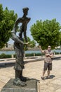 A Canadian tourist admires a statue at Meknes, Morocco.