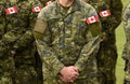 Canadian troops. Canadian Army. Canada flags on soldiers arm. Royalty Free Stock Photo