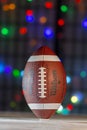 Canadian Wilson football with CFL logo with colourful lights on the background