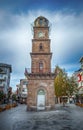Canakkale, Turkey - 10.11.2022. Five-storey Ottoman clock tower in Canakkale, dating from 1897. View with people.