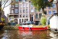 The canal in Amsterdam. Blue sky and boat. in the city. Free space for text.