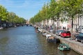 Canal in Amsterdam with historic mansions Royalty Free Stock Photo