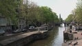 Canal in Amsterdam with the westertoren at the background