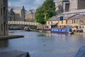 Canal barge moored outside a busy pub. Lancaster, UK