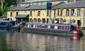 Canal barge moored outside a pub.