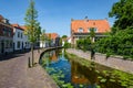 A canal in the beautiful historic center of the old village of Maasland, the Netherlands. Royalty Free Stock Photo