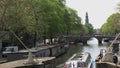 Canal boat in Amsterdam with tilt to the westertoren