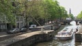 Canal boat in Amsterdam with the westertoren at the background