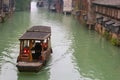 Canal boat in a water lane in the ancient water town Wuzhen (Unesco), China