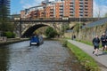 Canal Boat Approaching a Disused Arch Railway Viaduct Near Leeds.