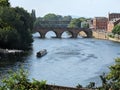 The River Severn at viewed from Worcester Cathedral,with canal boat and swans,Worcestershire,England,UK