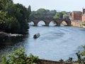 The River Severn at viewed from Worcester Cathedral,with canal boat and swans,Worcestershire,England,UK