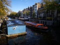 Canal boat and houses of Amsterdam city, in Holland, Netherlands