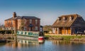 Canal boat moored alongside country house in Devizes, Wiltshire, UK Royalty Free Stock Photo