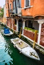 Canal with boats and colorful facades of old medieval houses in Venice Royalty Free Stock Photo