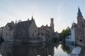 Canal in Bruges and famous Belfry tower on the background, Belgium Royalty Free Stock Photo