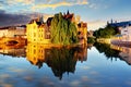 Canal in Bruges and famous Belfry tower on the background at sun Royalty Free Stock Photo