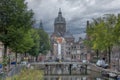 Canal and Cathedral in Amsterdam Before Rain Royalty Free Stock Photo