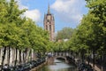 Canal and church tower of Delft, Holland Royalty Free Stock Photo