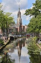 Canal and church tower in Delft, Holland Royalty Free Stock Photo