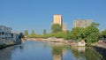 Canal in The Hague, with houseboats and apartment towers Royalty Free Stock Photo