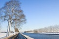 Canal in a cold white winter landscape Royalty Free Stock Photo