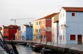 Canal and colorful houses lit by the setting sun in Burano Venice area Italy Royalty Free Stock Photo