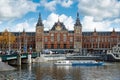 Canal cruise boat in front of Amsterdam central railway station