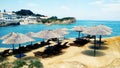 Canal DAmur on the island of Corfu with umbrellas, loungers, blue sea