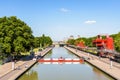 The canal de l`Ourcq splitting the parc de la Villette in Paris, France