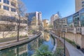 Canal flanked by pathways on a sunny day in San Antonio River Walk Texas