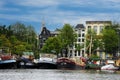 Canal with houseboats in the city of Amsterdam