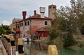 Canal and houses in Torcello, Venice, Italy