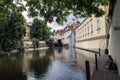 Canal of the Moldova river under the last arch of Charles Bridge