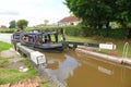 Canal narrow boat entering a lock Royalty Free Stock Photo