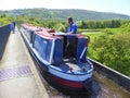 Canal narrowboat cruising over aqueduct