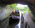 Canal narrowboat entering tunnel