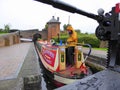 Canal narrowboat inside lock on rainy day Royalty Free Stock Photo