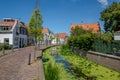 Canal in the old village of Maasland, Netherlannds Royalty Free Stock Photo