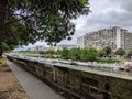 Canal Saint Martin, boats and builings in Paris France Royalty Free Stock Photo