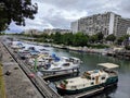 Canal Saint Martin, boats and builings in Paris France Royalty Free Stock Photo