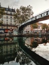 The canal Saint-Martin, view in an evening with the building reflex, Paris, France