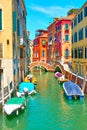 Canal with small bridge and moored boats in Venice Royalty Free Stock Photo