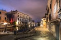 A canal - street with boats in Venice at night, Italy Royalty Free Stock Photo