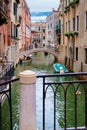 Canal surrounded by old palaces in Venice