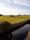 Canal by the Swilcan stone bridge at St Andrews Links Old Course in Scotland Royalty Free Stock Photo