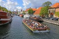 Canal tourboat on sightseeing trip on canal in Copenhagen, Denmark Royalty Free Stock Photo