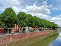 Canal with tree and blue sky Royalty Free Stock Photo